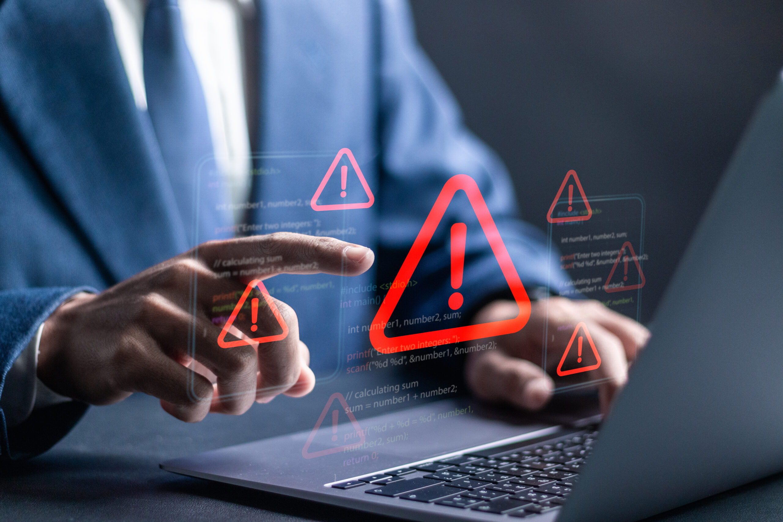 Ransomware malware attack and data breach. Businessman using laptop with spam virus on warning caution for notification on internet security protect